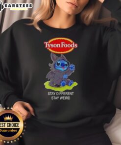 Alt Text: Cute Stitch cosplay wearing a Toothless X Tyson Foods sweatshirt with Stay Different, Stay Weird slogan.