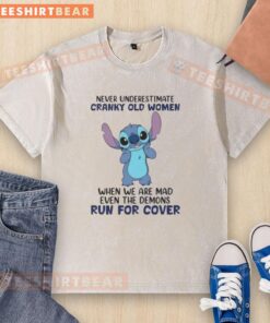 Alt Text: Cute Stitch design on a washed t-shirt with 'Never underestimate cranky old women' quote, perfect for fierce grandmas.