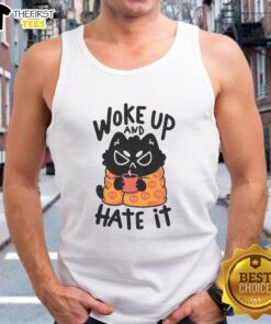 Funny cat wearing a tank top, looking grumpy after waking up, captures the essence of 'Funny Cat Woke Up And Hate It'.