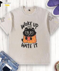 Funny cat waking up and looking grumpy on a washed T-shirt, perfect for humor lovers and cat enthusiasts.