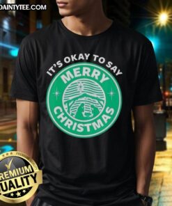 Alt Text: Funny It's Okay To Say Merry Christmas logo T-Shirt featuring festive graphics and a playful holiday message.