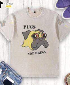 Funny pugs graphic on a washed T-shirt with the slogan 'Not Drugs' promoting a lighthearted message.