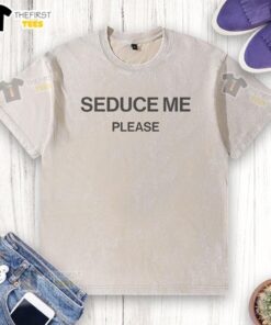 Funny Seduce Me Please washed t-shirt displayed on a hanger, featuring a playful graphic design in vibrant colors.