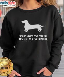 Alt Text: Funny Try Not To Trip Over My Wiener Sweatshirt featuring a playful design of wiener dogs and humorous text.