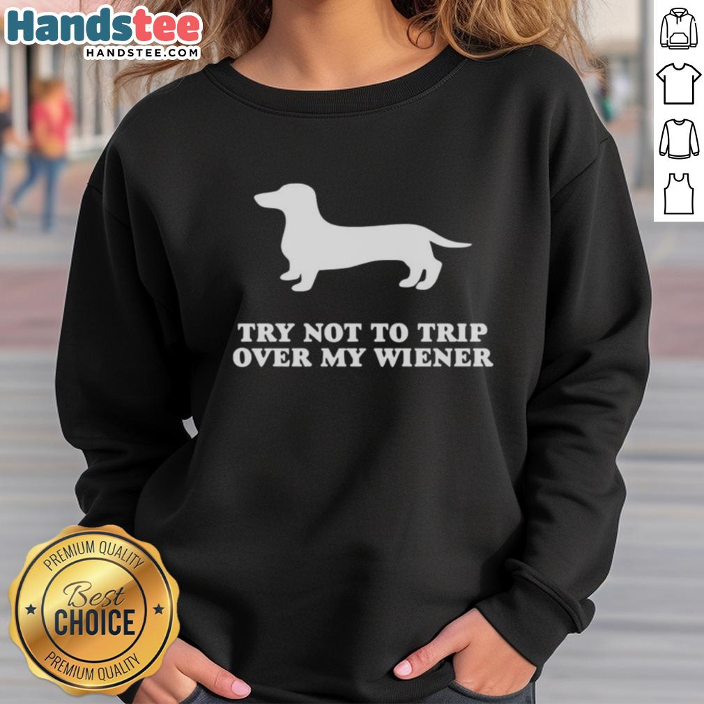 funny-try-not-to-trip-over-my-wiener-sweatshirt Alt Text: Funny Try Not To Trip Over My Wiener Sweatshirt featuring a playful design of wiener dogs and humorous text.