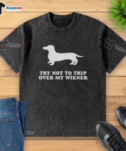 Funny Try Not To Trip Over My Wiener Washed T-Shirt featuring a humorous graphic design of a wiener dog.