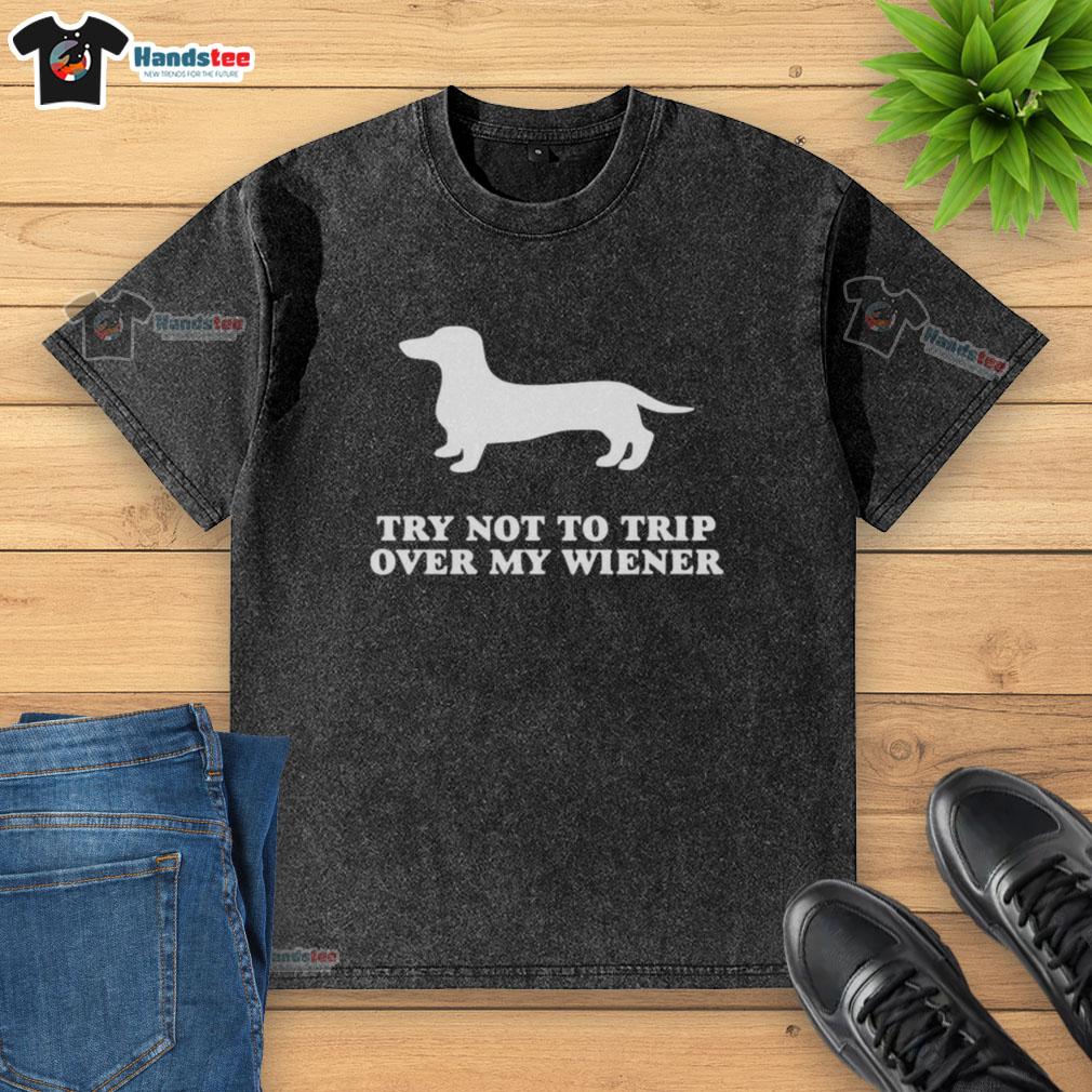 funny-try-not-to-trip-over-my-wiener-washed-t-shirt Funny Try Not To Trip Over My Wiener Washed T-Shirt featuring a humorous graphic design of a wiener dog.