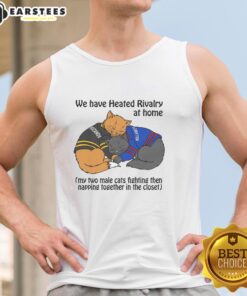 Alt Text: Two male cats playfully fighting and then napping together in a closet, showcasing their funny rivalry at home.