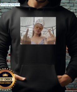 Ariana Grande in a stylish 'For Good' hoodie from Wicked, showcasing her fashion and love for the musical.