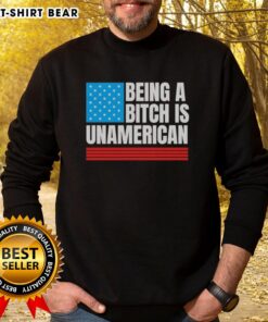 Alt Text: USA flag sweatshirt with the phrase 'Good Being a Bitch is Unamerican' promoting bold self-expression and patriotism.