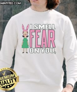 Louise from Bob's Burgers wearing 'I Smell Fear On You' sweatshirt, perfect for fans of the show and cozy style.