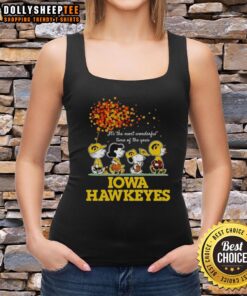 Good Charlie Brown, Sally Brown, Snoopy, and Woodstock in Iowa Hawkeyes tank top, celebrating the festive season.