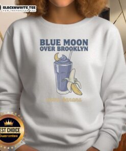 Good Christopher Grady and Scott Hunter wearing Blue Moon Over Brooklyn Extra Banana Sweatshirt in a vibrant setting.