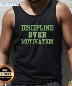 Alt Text: Fit person wearing a 'Good Discipline Over Motivation' tank top during a gym workout, showcasing consistency in fitness.