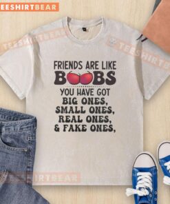 Humorous washed t-shirt featuring the quote 'Good friends are like boobs: big, small, real, and fake' for friend-themed gifts.