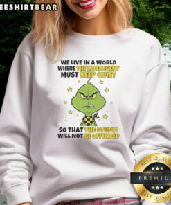 Good Grinch sweatshirt featuring 'We Live In A World Where The Intelligent Must Keep Quiet' design, perfect for holiday wear.