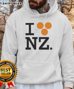 Orlando Bloom wearing a 'Good I Love NZ' hoodie, showcasing a stylish design perfect for fans of New Zealand.