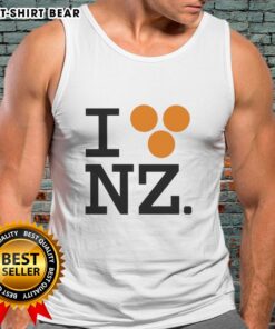 Orlando Bloom wearing a 'Good I Love NZ' tank top, showcasing a stylish and casual look perfect for summer vibes.