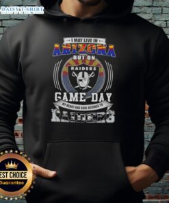 Person wearing a Las Vegas Raiders football hoodie, showcasing team spirit on game day while living in Arizona.