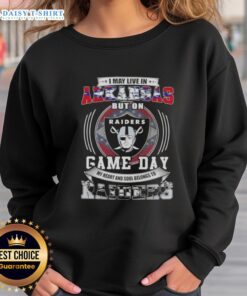 Cozy sweatshirt featuring 'Good I May Live in Arkansas But On Game Day My Heart and Soul Belongs to Las Vegas Raiders' design.