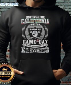 Person wearing a Las Vegas Raiders football hoodie, showcasing team spirit in California on game day.