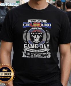 Person wearing a 'Good I May Live In Colorado But On Game Day My Heart Belongs To Las Vegas Raiders' T-shirt.
