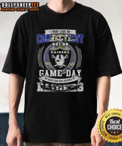 Connecticut fan wearing a Las Vegas Raiders football T-shirt, showcasing team spirit on game day.