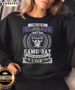 Alt Text: Fan wearing a Raiders football sweatshirt, showcasing pride for Las Vegas Raiders on game day in Pennsylvania.