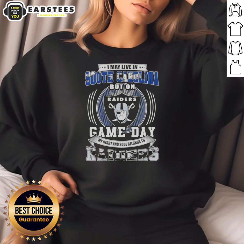 good-i-may-live-in-south-carolina-but-on-game-day-my-heart-and-soul-belongs-to-las-vegas-raiders-football-sweatshirt South Carolina fan wearing a Las Vegas Raiders football sweatshirt on game day, showcasing team spirit and pride.