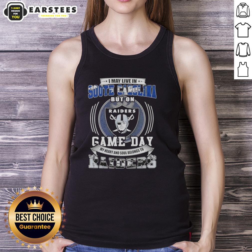 good-i-may-live-in-south-carolina-but-on-game-day-my-heart-and-soul-belongs-to-las-vegas-raiders-football-tank-top Woman wearing a tank top that reads 'Good I May Live In South Carolina But On Game Day My Heart Belongs To Raiders'.