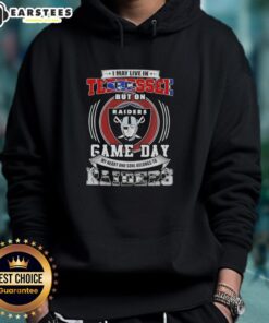 Fan wearing a Las Vegas Raiders hoodie, showing team spirit on game day, despite living in Tennessee.