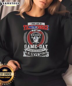 Alt Text: Fan wearing a 'Game Day' sweatshirt showing support for Las Vegas Raiders football while living in Tennessee.