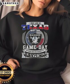 Comfortable sweatshirt with 'I may live in Texas, but my heart belongs to Las Vegas Raiders' for football fans.
