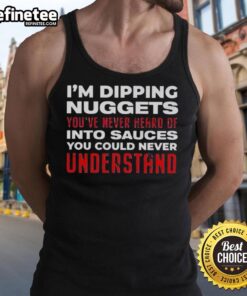 Person wearing a 'Good Im Dipping Nuggets' tank top, enjoying unique sauces with chicken nuggets at a vibrant outdoor setting.