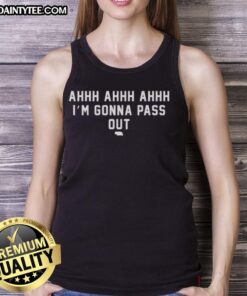 Alt Text: Woman wearing a Good I'm Gonna Pass Out Nebraska Cornhuskers tank top at a football game, showcasing team spirit.