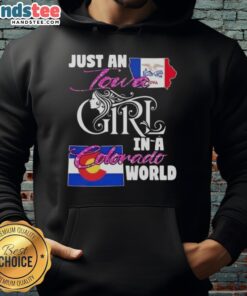 Cozy 'Good Just An Iowa Girl In A Colorado World' hoodie worn by a smiling woman in a scenic Colorado landscape.