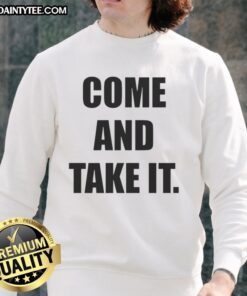 Kiernan Shipka wearing a stylish 'Come And Take It' sweatshirt, showcasing trendy casual fashion.