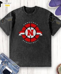 Alt Text: Classic circle logo of the Nebraska Cornhuskers basketball on a washed t-shirt, showcasing team spirit and style.