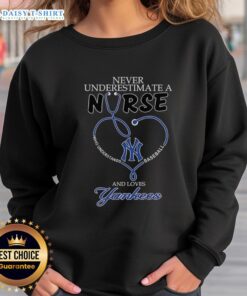 Alt Text: Nurse sweatshirt featuring a stethoscope and heart with New York Yankees theme, perfect for baseball-loving healthcare workers.