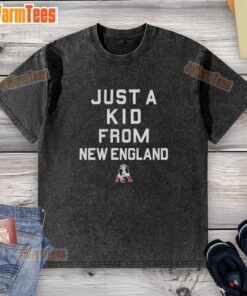 Good New England Patriots Just A Kid From New England washed t-shirt displayed on a hanger in a bright room.