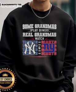 Funny sweatshirt featuring New York Yankees and Giants, saying 'Real Grandmas Watch' for sports-loving grandmas.