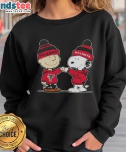 Good Peanuts Charlie Brown fist bump with Snoopy on Atlanta Falcons football sweatshirt, perfect for fans.