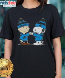 Charlie Brown and Snoopy fist bump in Carolina Panthers football ladies tee, celebrating friendship and team spirit.