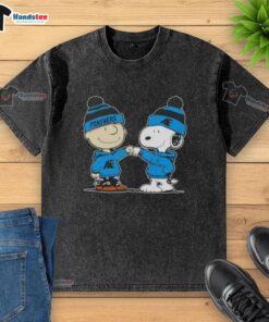Good Peanuts Charlie Brown fist bump with Snoopy, featuring Carolina Panthers football design on a washed T-shirt.