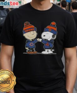 Good Peanuts Charlie Brown and Snoopy fist bump on Chicago Bears football T-shirt, perfect for fans of both!