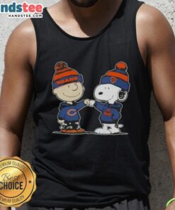 Good Peanuts Charlie Brown fist bumping Snoopy in a Chicago Bears football tank top, celebrating sports friendship.