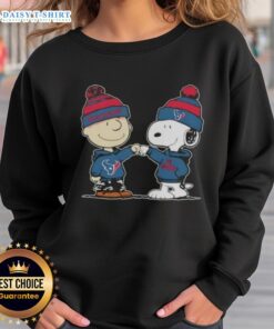 Charlie Brown and Snoopy fist bump in Houston Texans football sweatshirt, showcasing good vibes and team spirit.