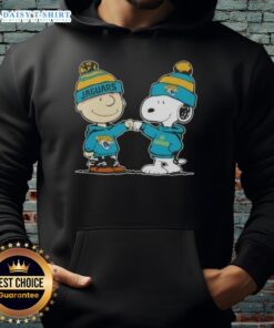 Good Peanuts Charlie Brown fist bump with Snoopy in Jacksonville Jaguars football hoodie, showcasing team spirit.