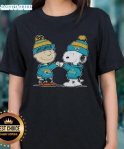 Charlie Brown and Snoopy fist bump in a Jacksonville Jaguars football ladies tee design featuring peanuts theme.