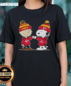 Charlie Brown and Snoopy fist bump in Kansas City Chiefs ladies tee featuring Good Peanuts design.